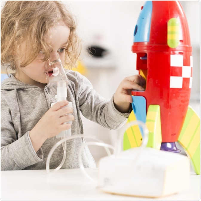 Child with cystic fibrosis using nebulizer. Image Credit: Photographee.eu / Shutterstock